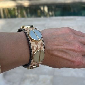 Bracelet, gold tone and imitation hide. Used good condition.